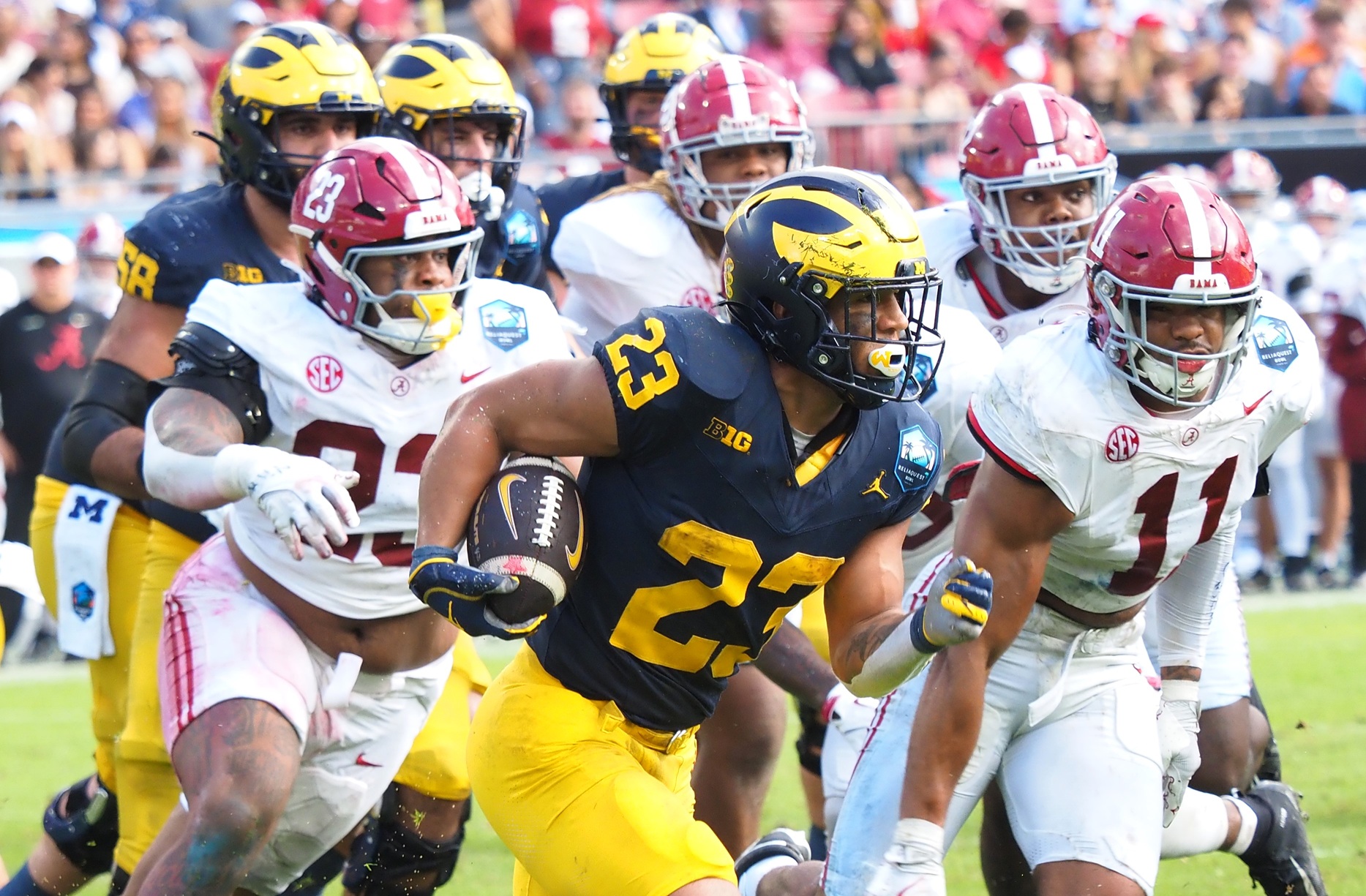 Jordan Marshall running past Alabama in the ReliaQuest Bowl