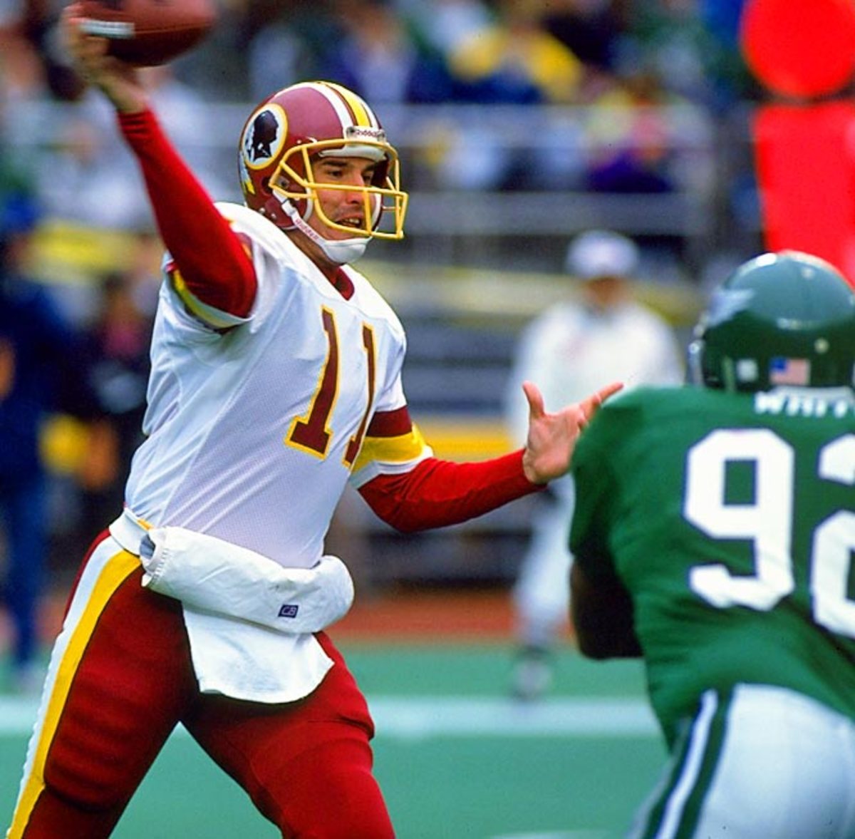 Washington Redskins quarterback Mark Rypien winds up to throw a pass against the Philadelphia Eagles during the 1991 NFL season.
